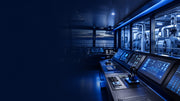 Marine automation control console overlooking vessel machinery